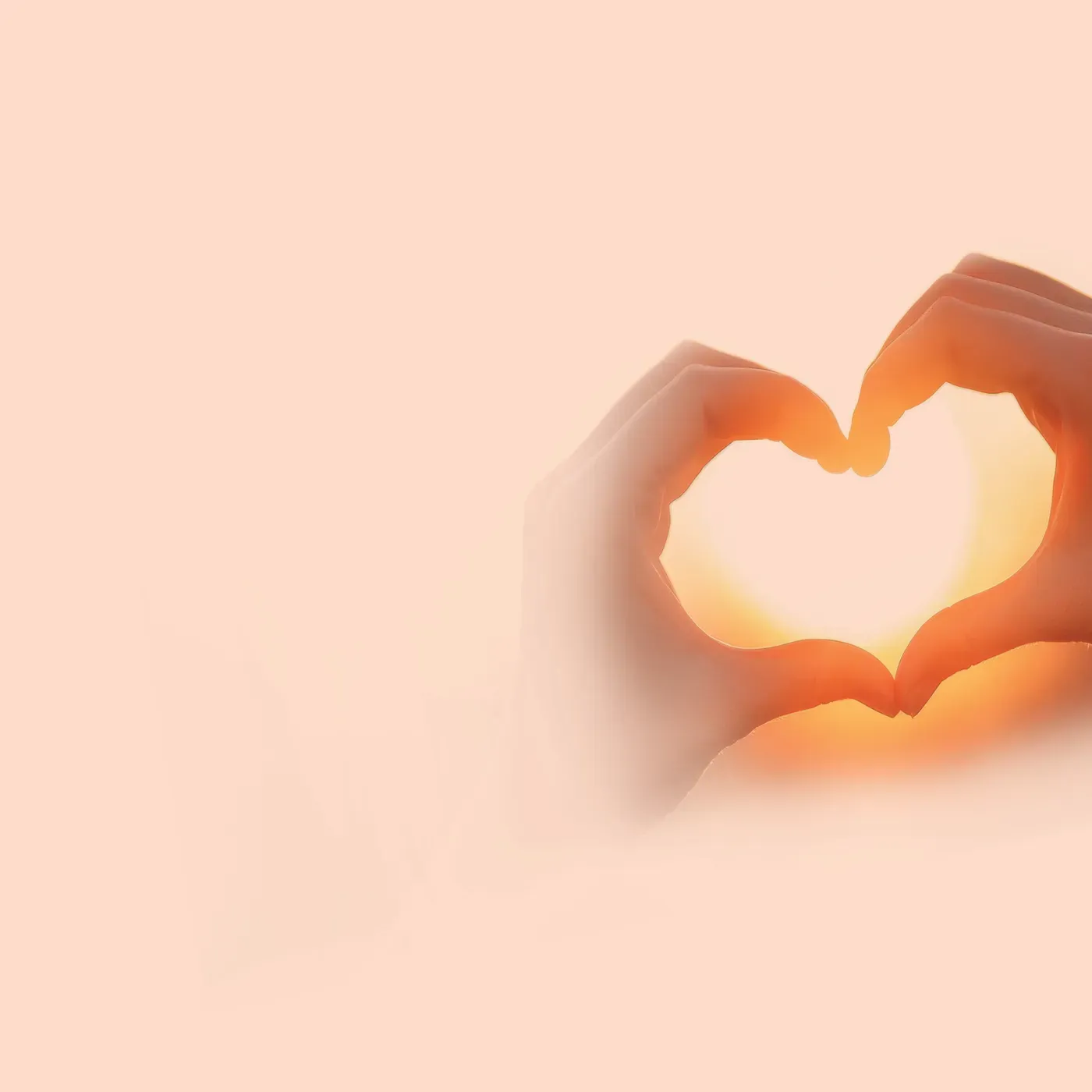 Hands making a heart shape against a sunset, Sexual Health at Pan Pharmacy
