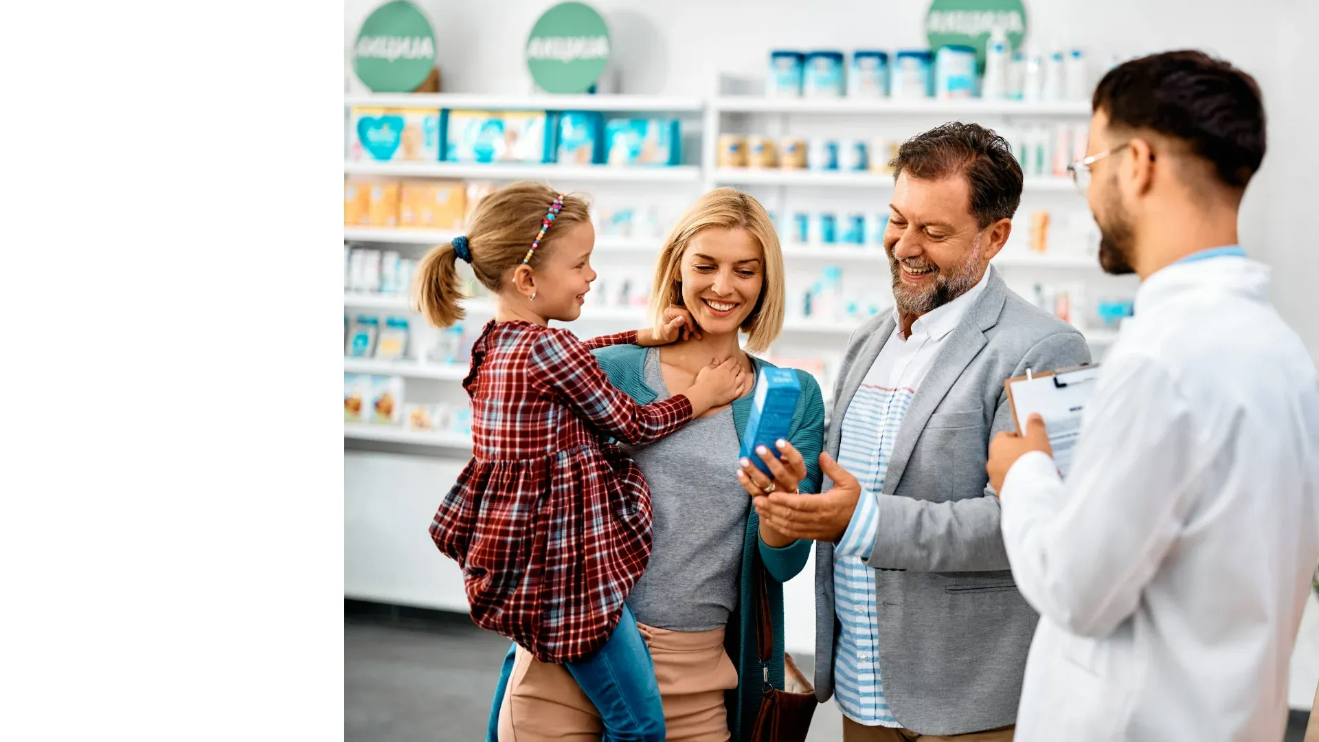 Pharmacist helping a family choose medicine at Pan Pharmacy Birmingham