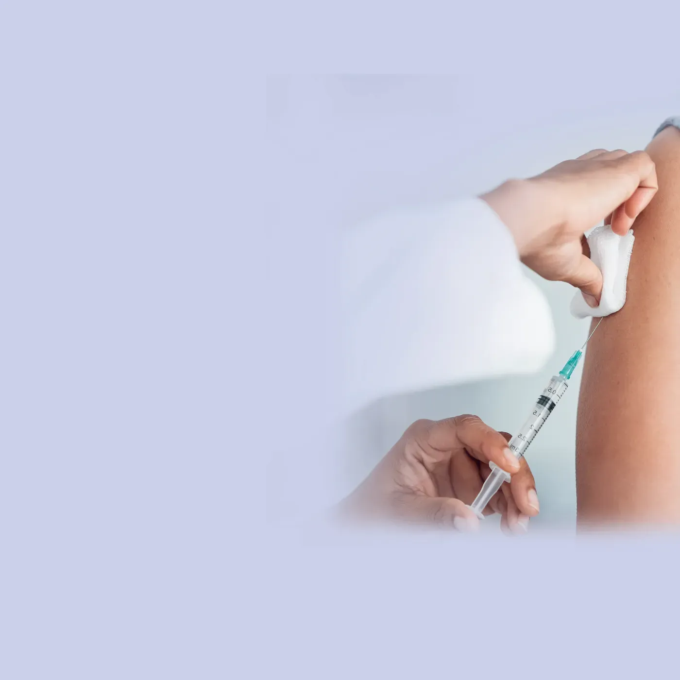 Pharmacist giving a vaccination in the upper arm, Vaccines at Pan Pharmacy