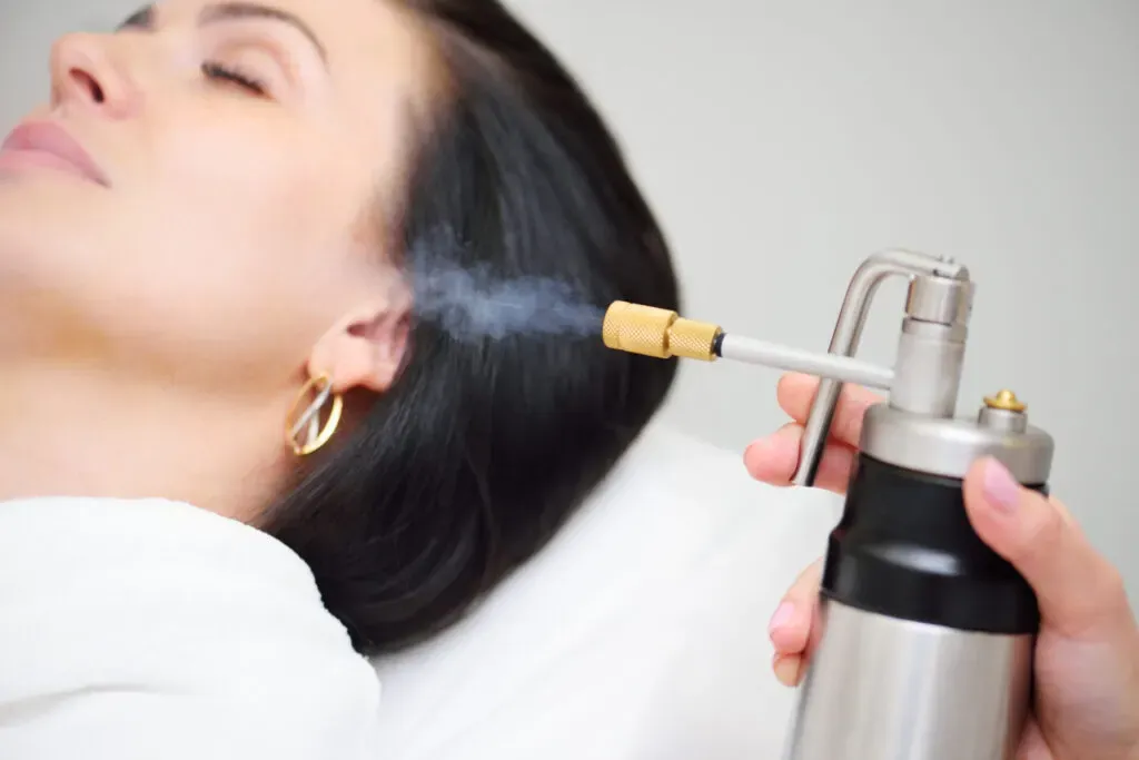 Woman receiving cryotherapy skin treatment at Pan Pharmacy Birmingham